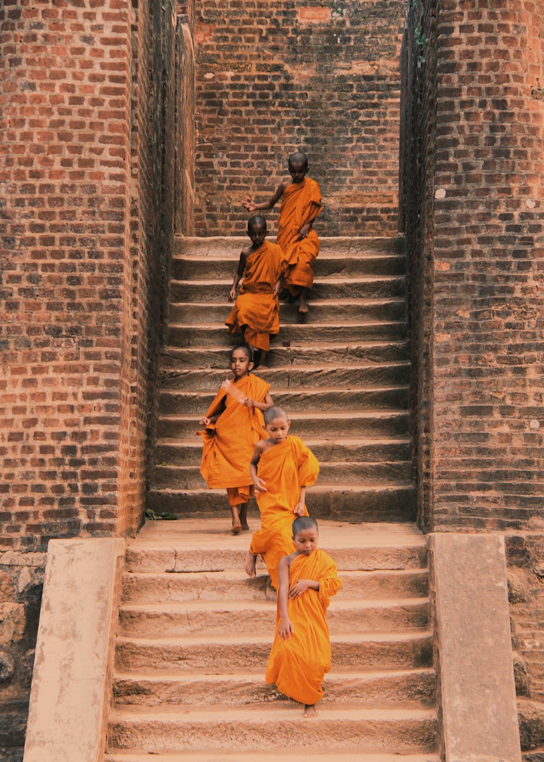man-in-yellow-jacket-walking-on-gray-concrete-stairs-r4picb2reug